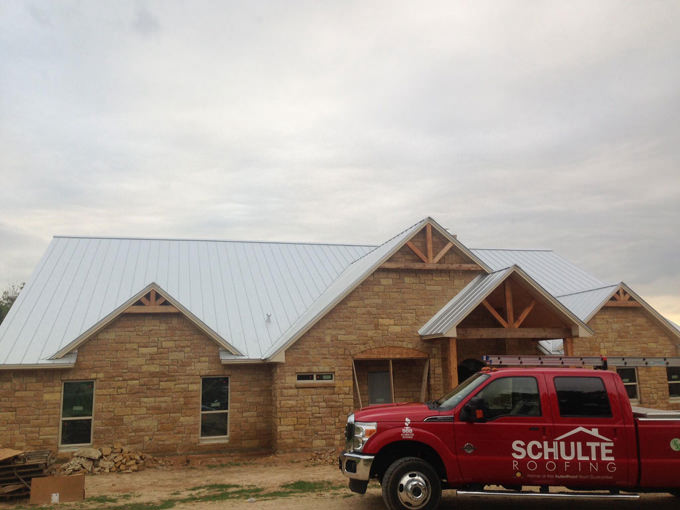 bryan roofer completes a metal roof