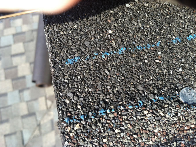 chalk lines left behind by a college station roofer mini