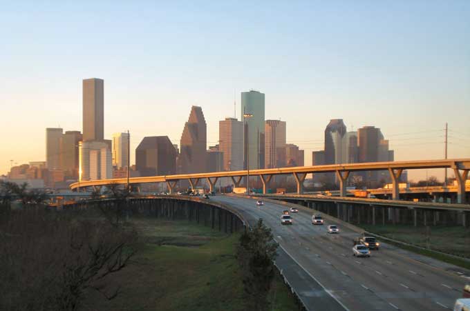 Roofing houston with new tile coatings to reduce smog.