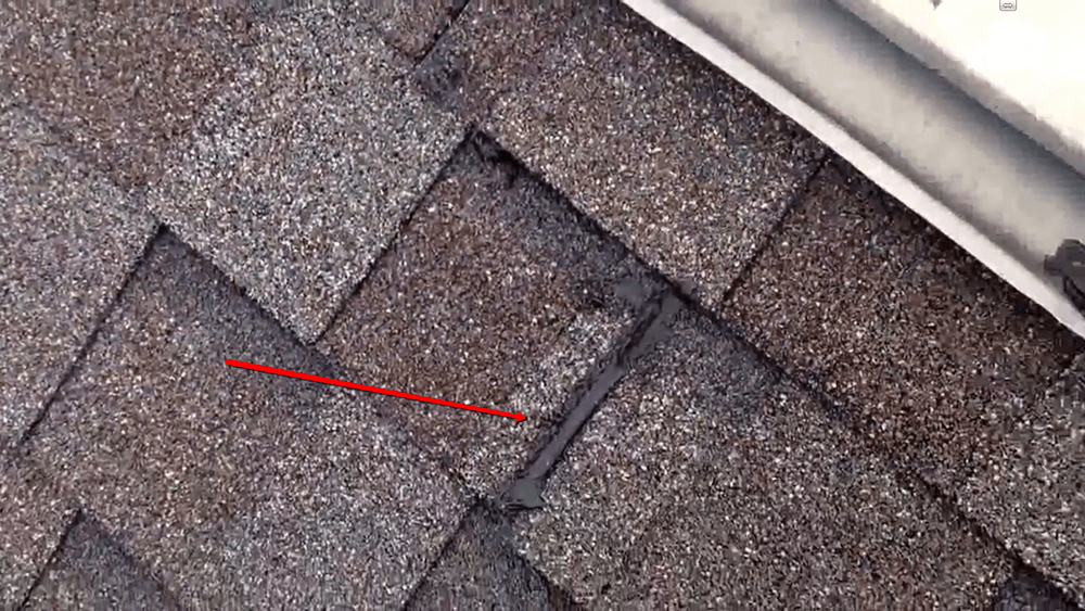 College Station roofer seals loose shingle