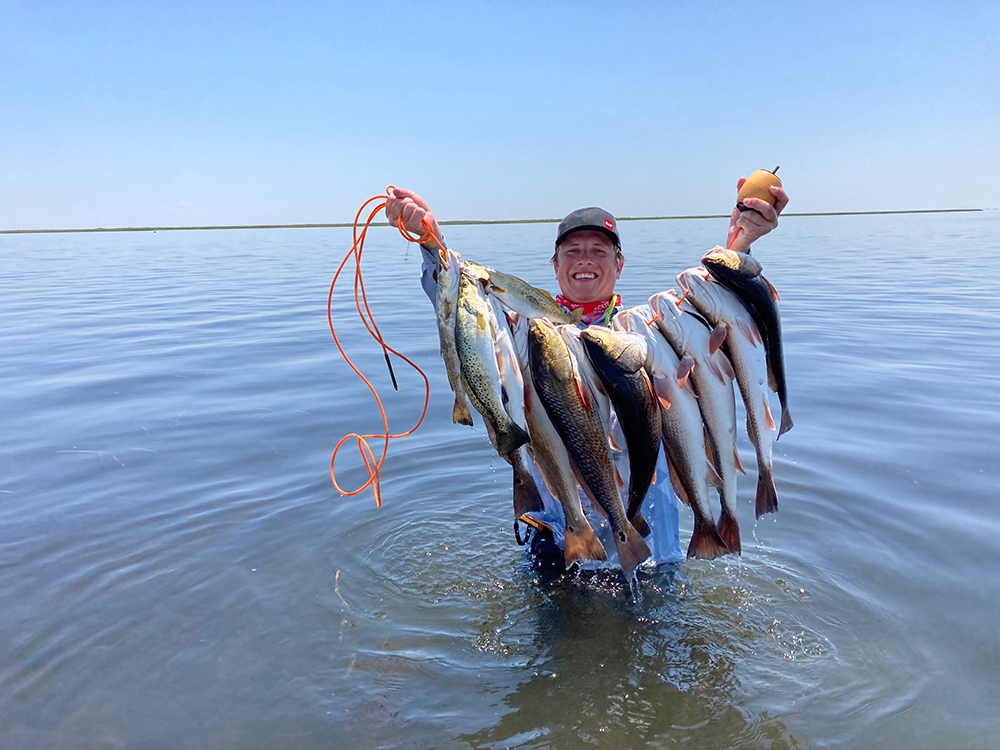 Regan Powell catches Fish on Schulte Roofing Company Fishing Trip