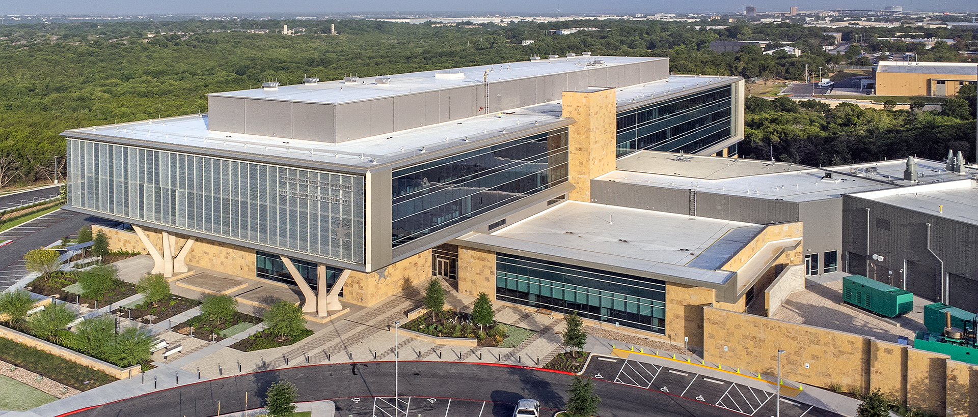 Texas Department of Public Safety-Schulte Roofing Texas Department of Public Safety's finished commercial flat roof by Schulte Roofing with view of the entire building and parking lot.