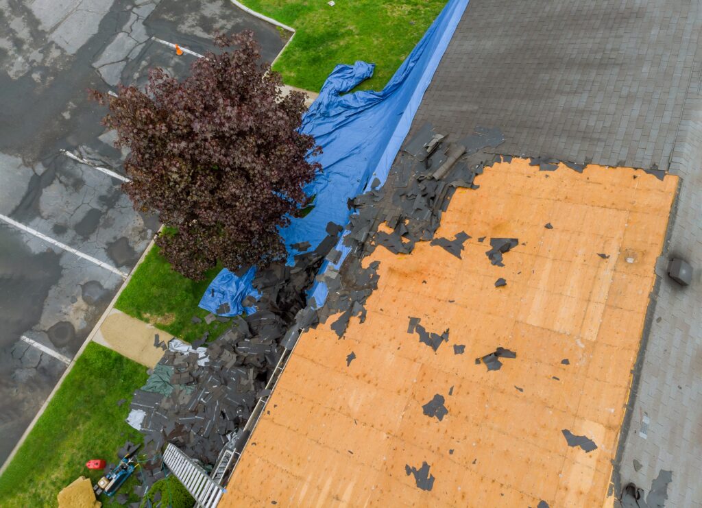 Construction worker on a renovation roof the house installed new shingles
